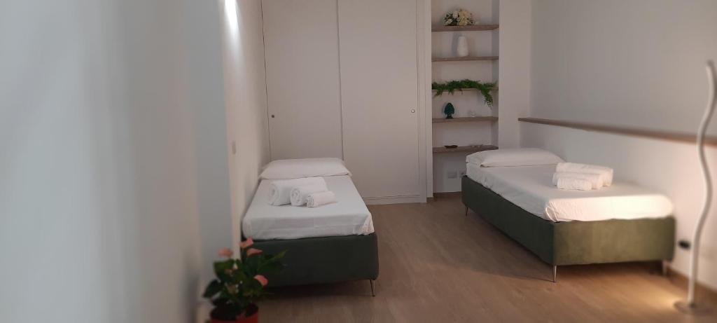 Posteľ alebo postele v izbe v ubytovaní Dadà Loft