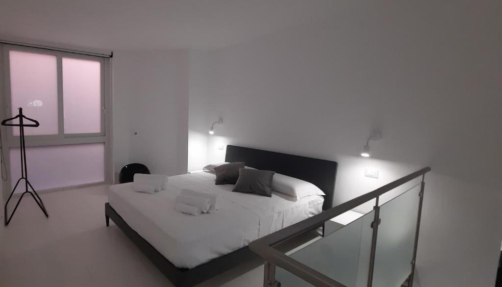 Posteľ alebo postele v izbe v ubytovaní Dadà Loft