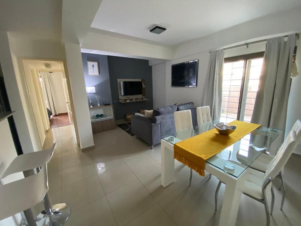 a living room with a table and a couch at Patio San Ignacio in San Juan