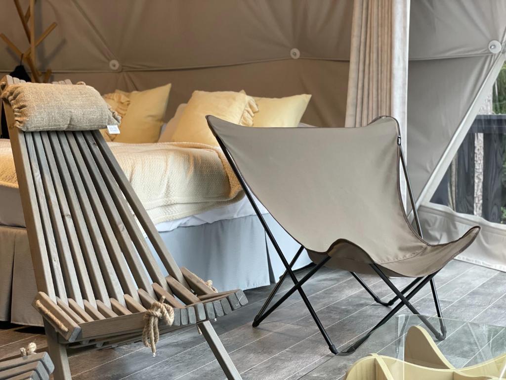 Rúm í herbergi á TOCORO. Mt.Fuji CAMP&GLAMPING