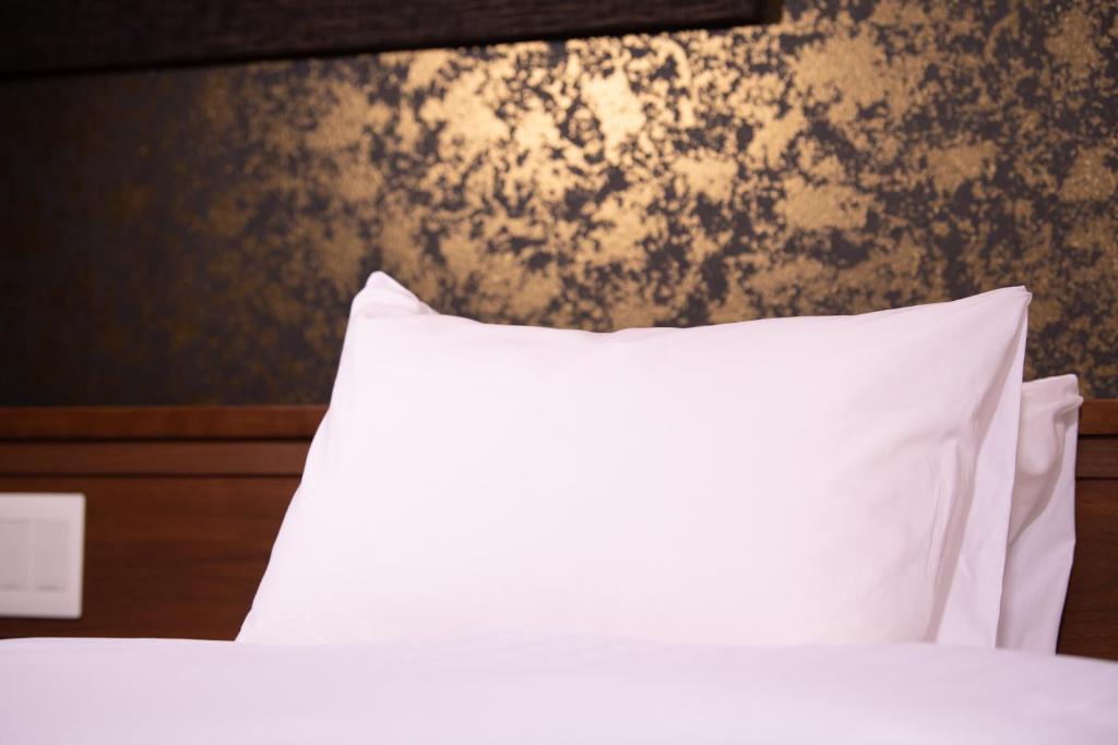 Postel nebo postele na pokoji v ubytování Hotel Celeste Shizuoka
