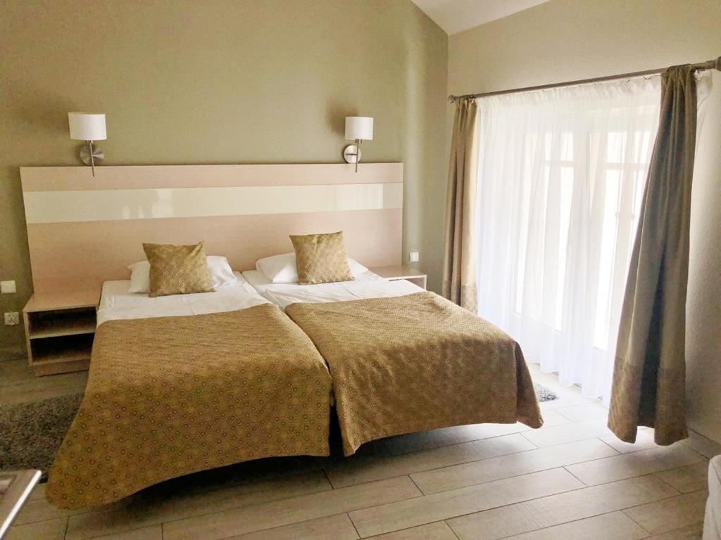 Posteľ alebo postele v izbe v ubytovaní Atrakcyjny Apartament Czarna Góra