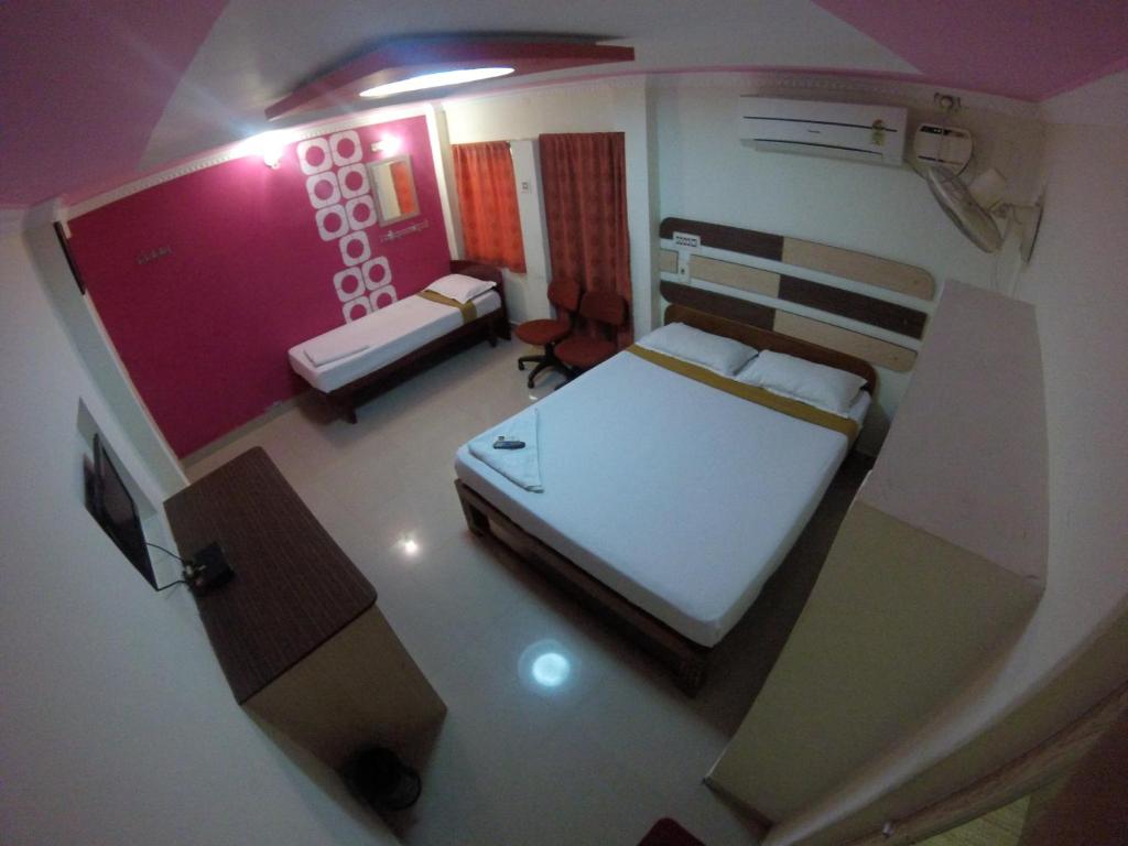 Postel nebo postele na pokoji v ubytování Just Guest House, Chennai Airport