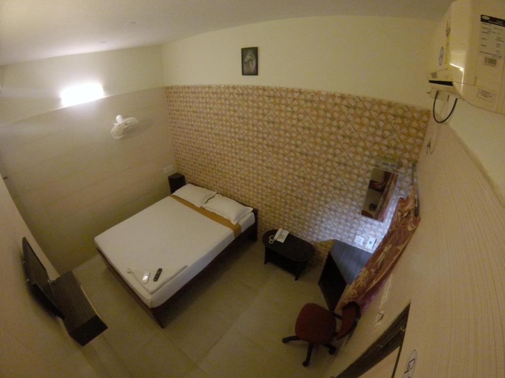 Postel nebo postele na pokoji v ubytování Just Guest House, Chennai Airport