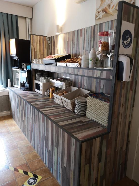Kuchyň nebo kuchyňský kout v ubytování Hotel Sfinx