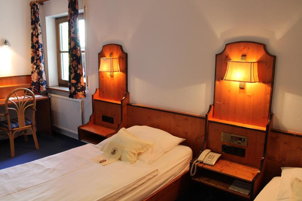 Postel nebo postele na pokoji v ubytování Hotel Höfler B&B