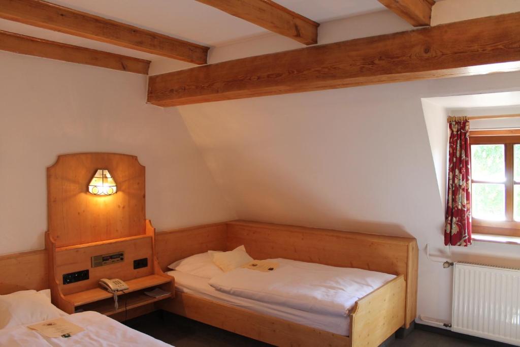 Postel nebo postele na pokoji v ubytování Hotel Höfler B&B