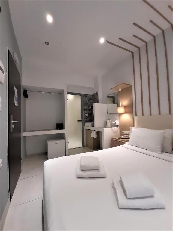 Postel nebo postele na pokoji v ubytování Elite Hotel