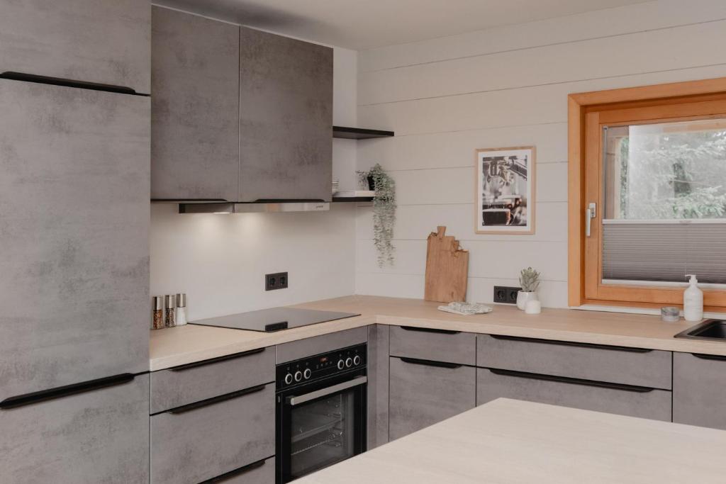 Kuchyňa alebo kuchynka v ubytovaní mei chalet - DAS BARBARA
