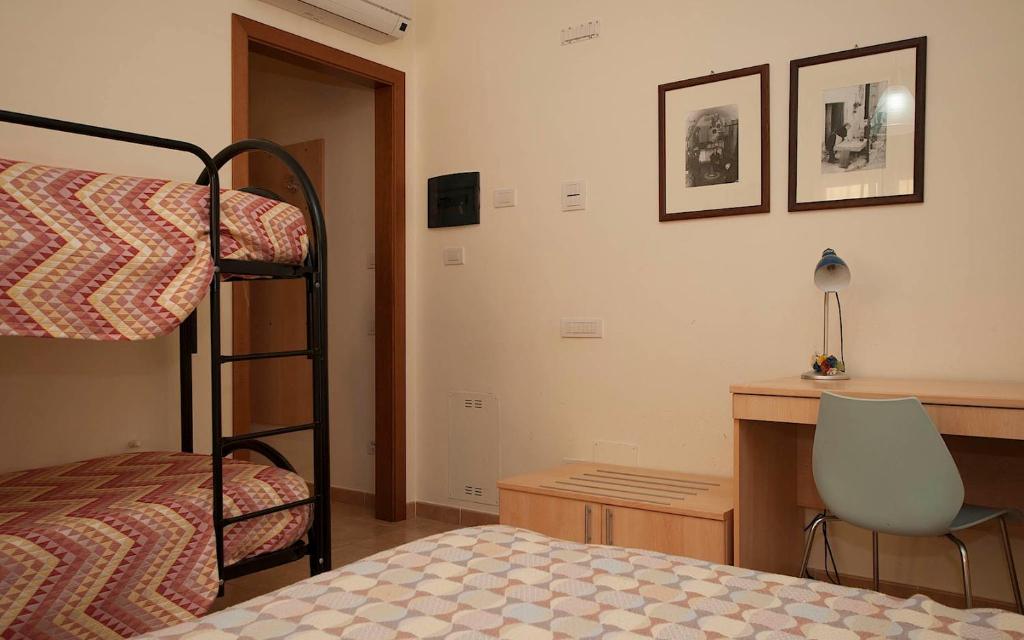 Postel nebo postele na pokoji v ubytování B&B & Residence Pozzo Misseo