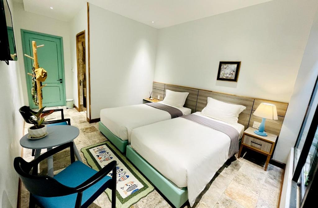 Postel nebo postele na pokoji v ubytování Côn Đảo House