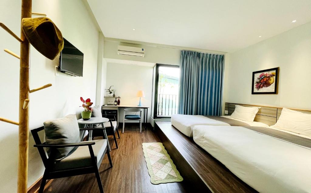 Postel nebo postele na pokoji v ubytování Côn Đảo House
