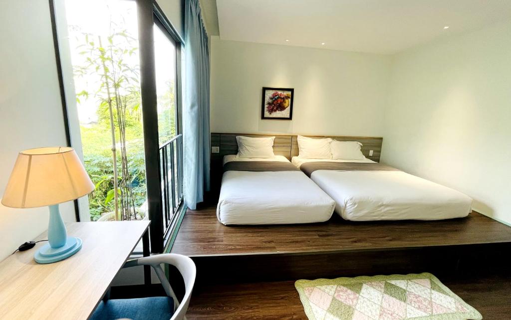 Postel nebo postele na pokoji v ubytování Côn Đảo House