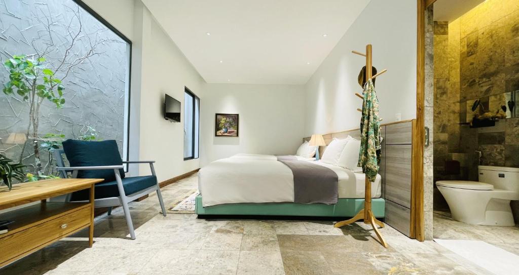 Postel nebo postele na pokoji v ubytování Côn Đảo House