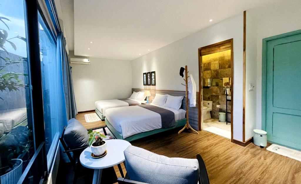 Postel nebo postele na pokoji v ubytování Côn Đảo House