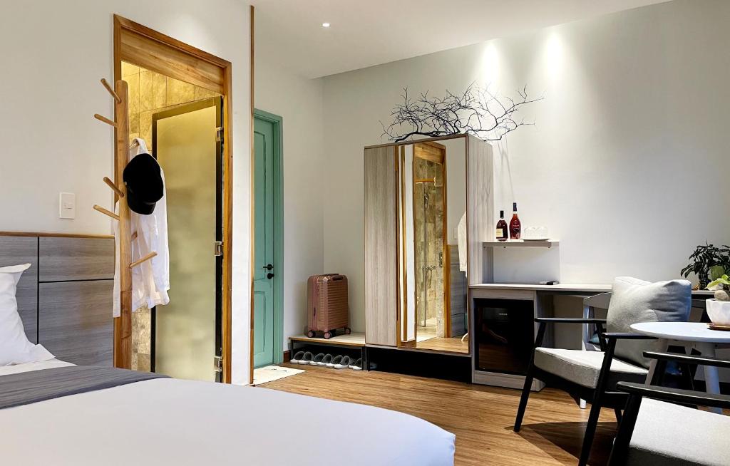 Postel nebo postele na pokoji v ubytování Côn Đảo House