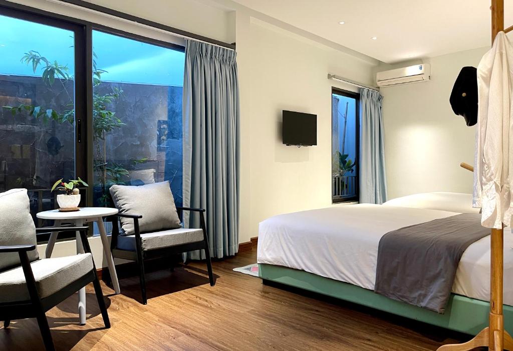 Postel nebo postele na pokoji v ubytování Côn Đảo House