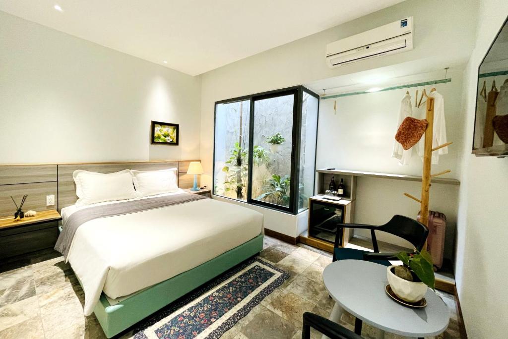 Postel nebo postele na pokoji v ubytování Côn Đảo House