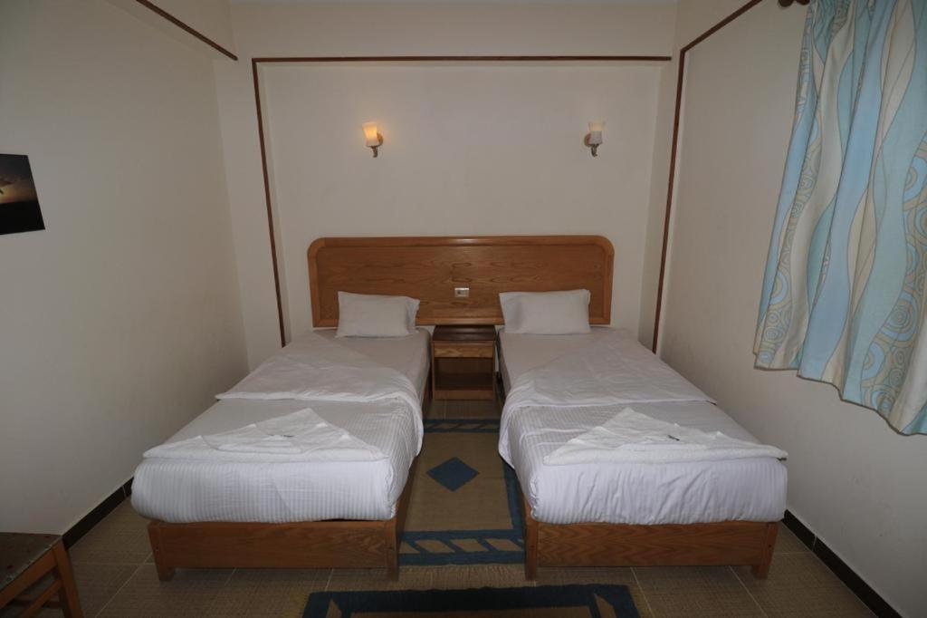 Postel nebo postele na pokoji v ubytování Acacia Dahab Hotel