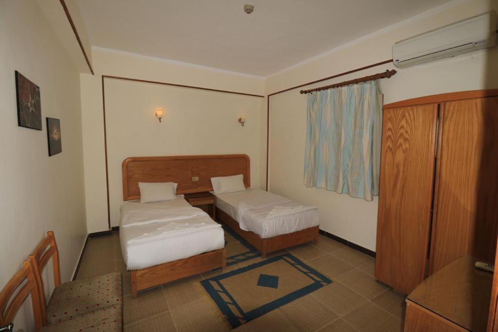 Postel nebo postele na pokoji v ubytování Acacia Dahab Hotel