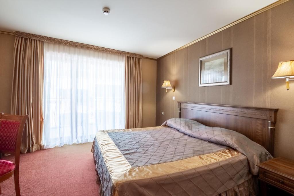 Postel nebo postele na pokoji v ubytování Hotel Mistral