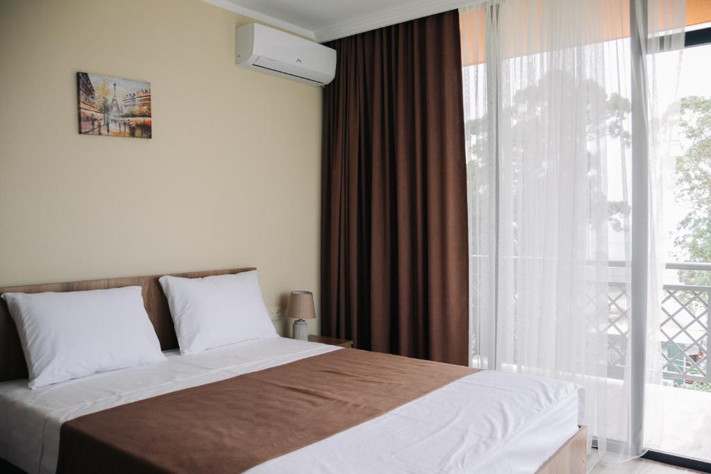 Postel nebo postele na pokoji v ubytování Scorpio Hotel Gonio