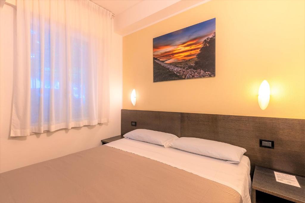 Postel nebo postele na pokoji v ubytování La Tavernetta