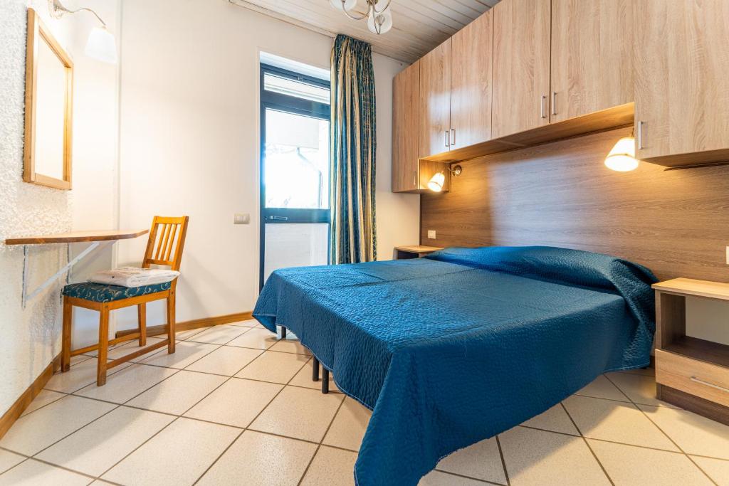 Letto o letti in una camera di Arcobaleno Village
