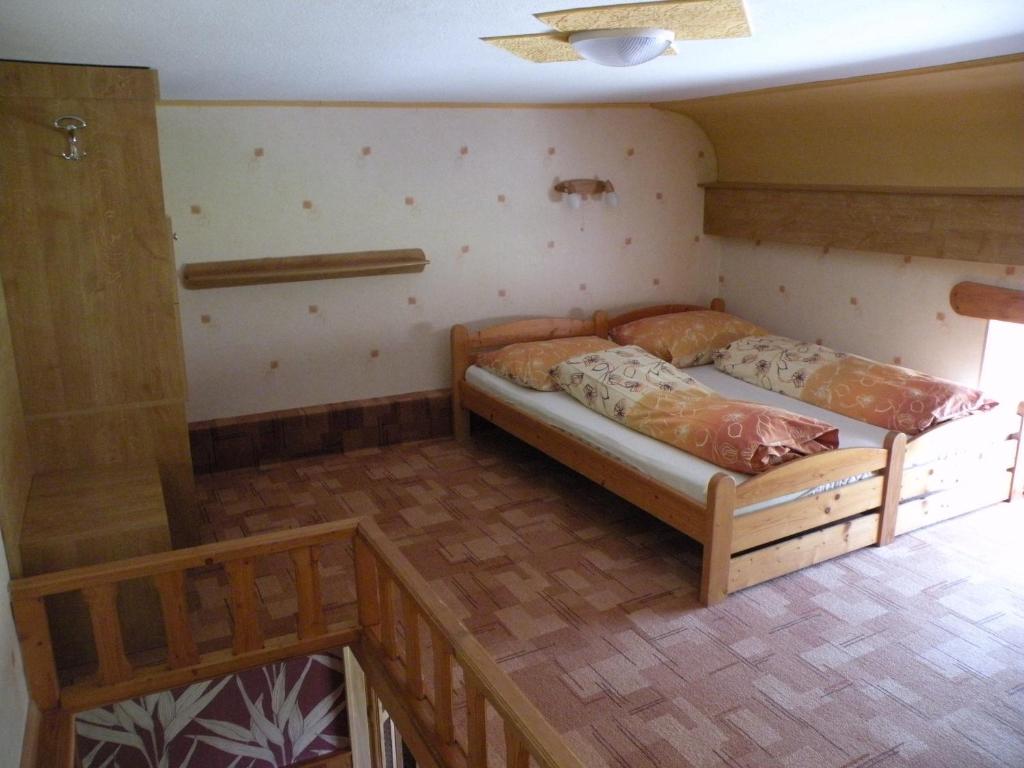 Posteľ alebo postele v izbe v ubytovaní Hotel Lesní dům