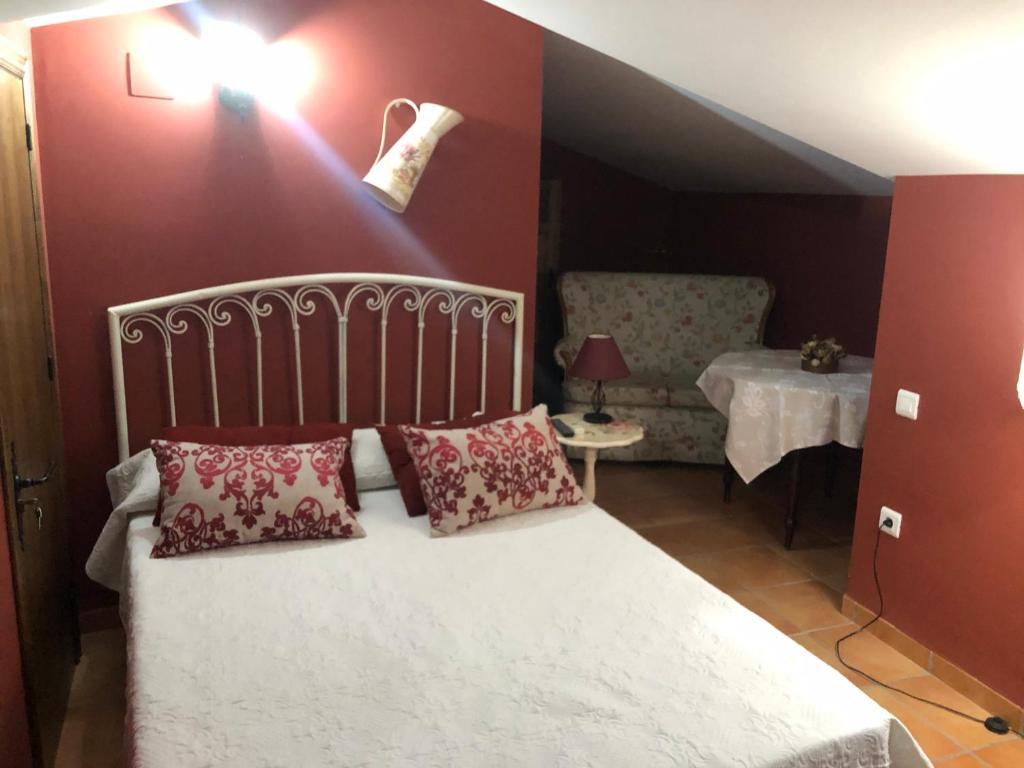 Postel nebo postele na pokoji v ubytování Hostal La Caballeriza