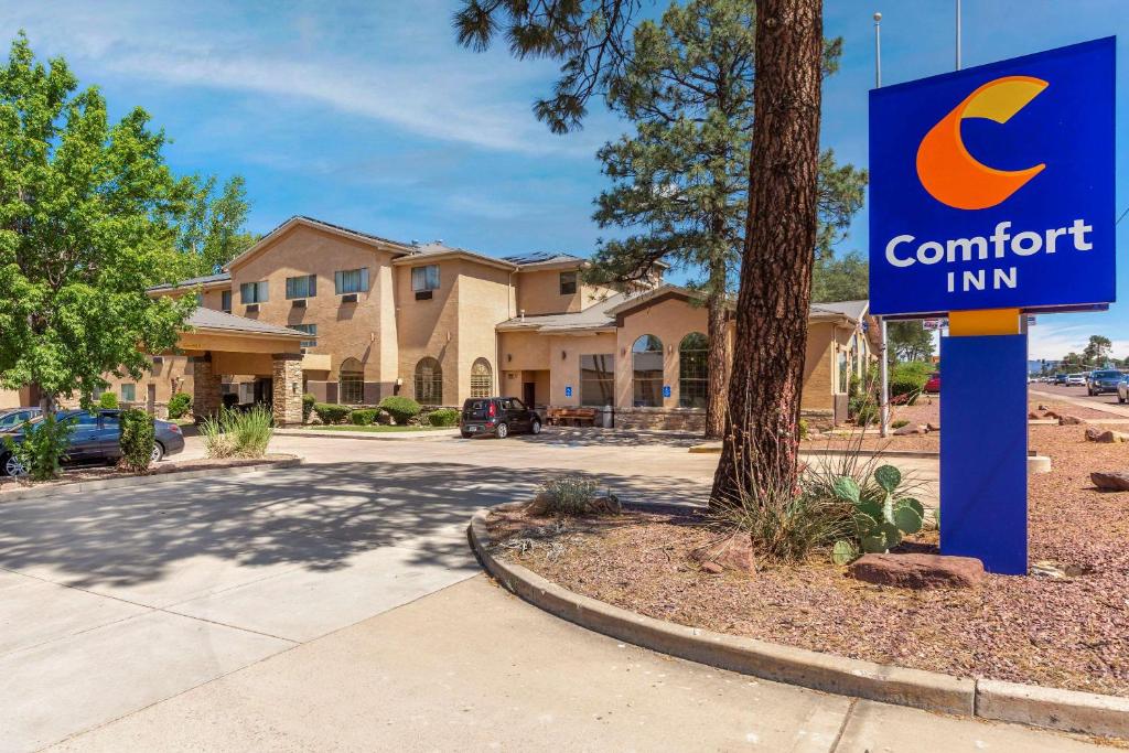 a comfort inn sign in front of a house at Comfort Inn Payson in Payson