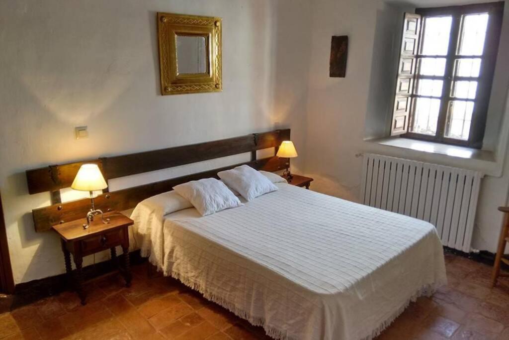 Postel nebo postele na pokoji v ubytování Casa El Carmen