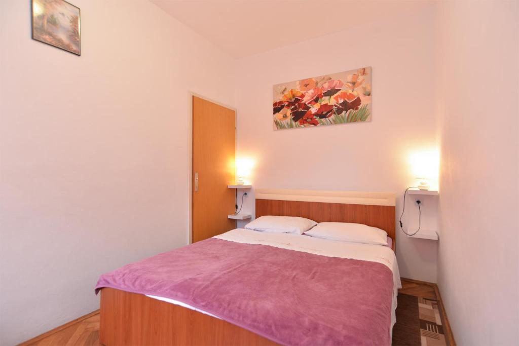 Łóżko lub łóżka w pokoju w obiekcie Apartments Fazana 407