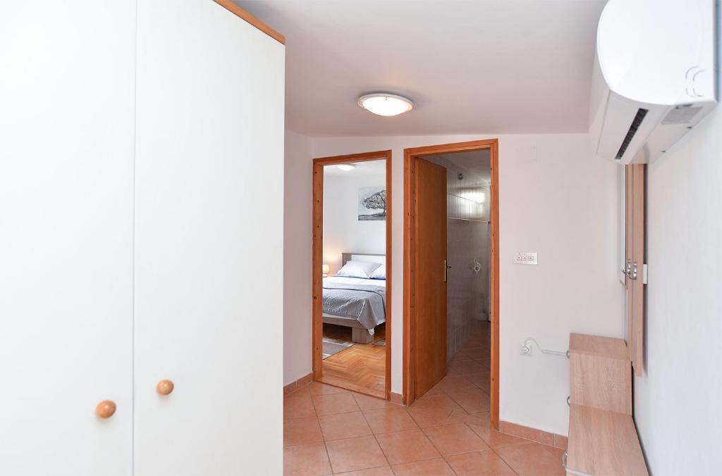 Łóżko lub łóżka w pokoju w obiekcie Apartments Fazana 407
