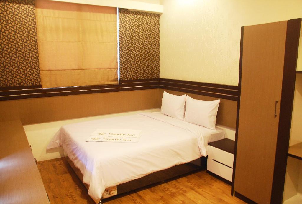 Un ou plusieurs lits dans un hébergement de l'établissement Gandhi Inn