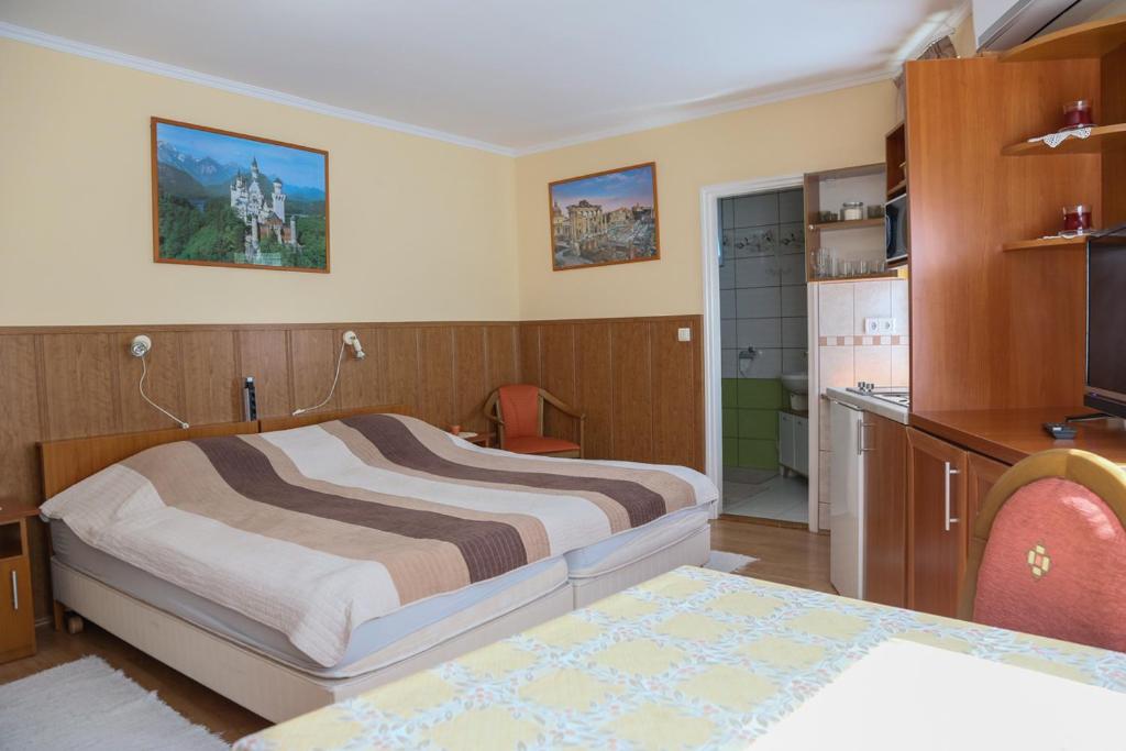 Posteľ alebo postele v izbe v ubytovaní Molnár Apartment