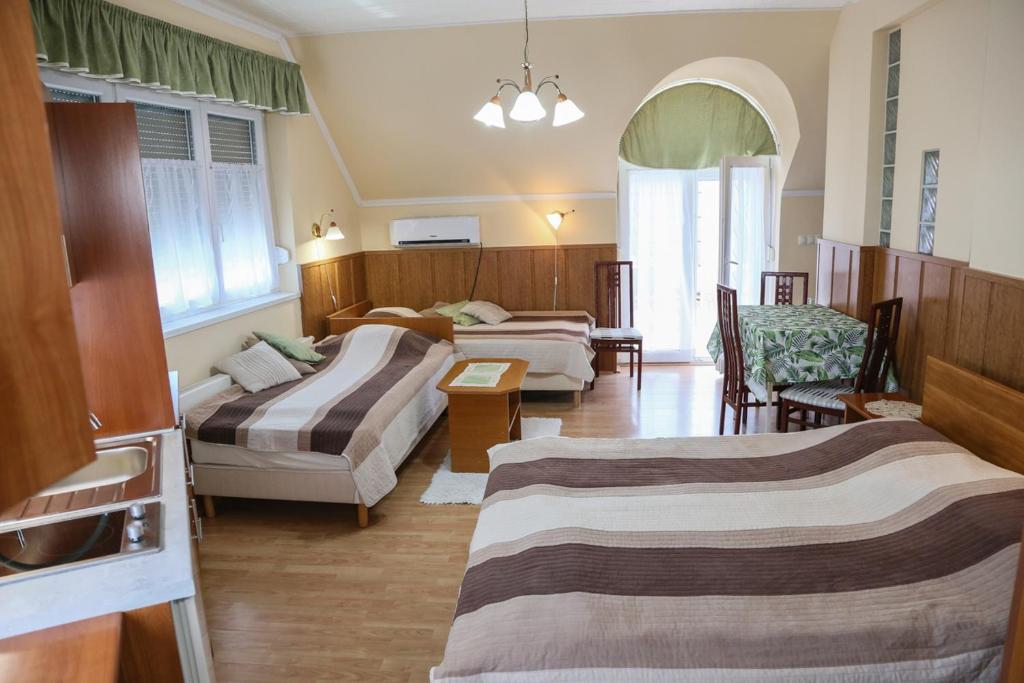 Posteľ alebo postele v izbe v ubytovaní Molnár Apartment