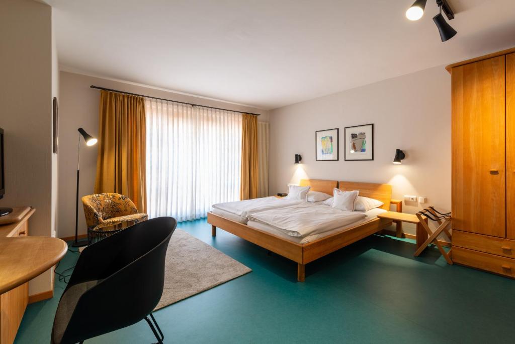 Postel nebo postele na pokoji v ubytování Hotel am Torturm