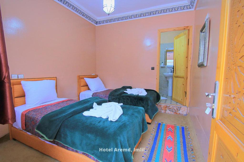 Postel nebo postele na pokoji v ubytování Hotel Igoudar Armed