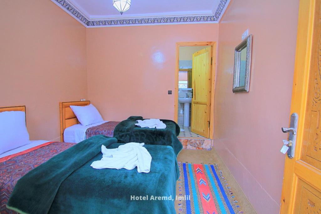 Postel nebo postele na pokoji v ubytování Hotel Igoudar Armed