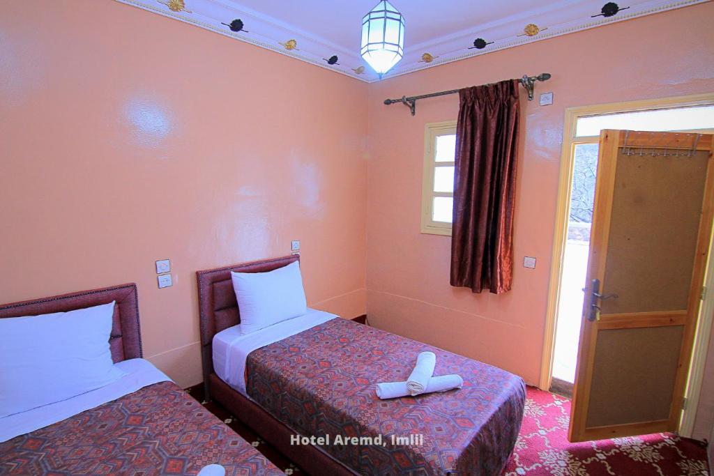 Postel nebo postele na pokoji v ubytování Hotel Igoudar Armed