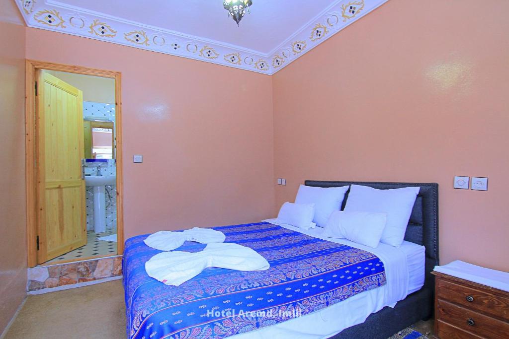 Postel nebo postele na pokoji v ubytování Hotel Igoudar Armed