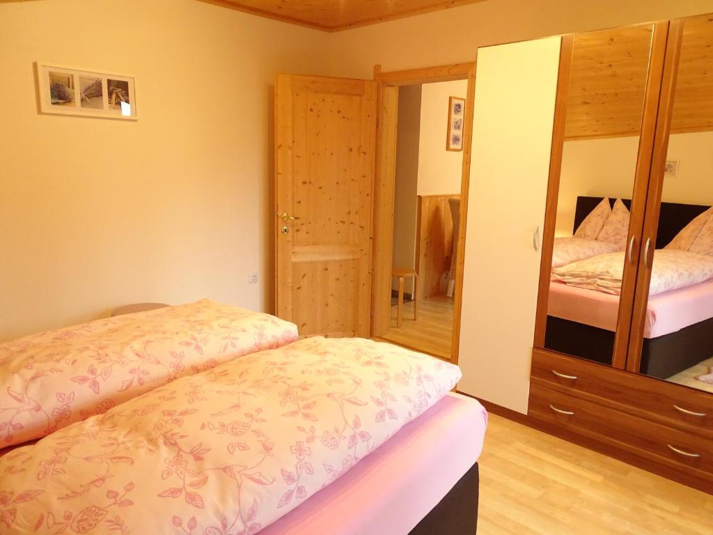 A bed or beds in a room at Appartementhaus Hochkönig 1 - Alpenrose