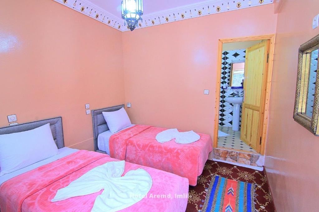 Postel nebo postele na pokoji v ubytování Hotel Igoudar Armed