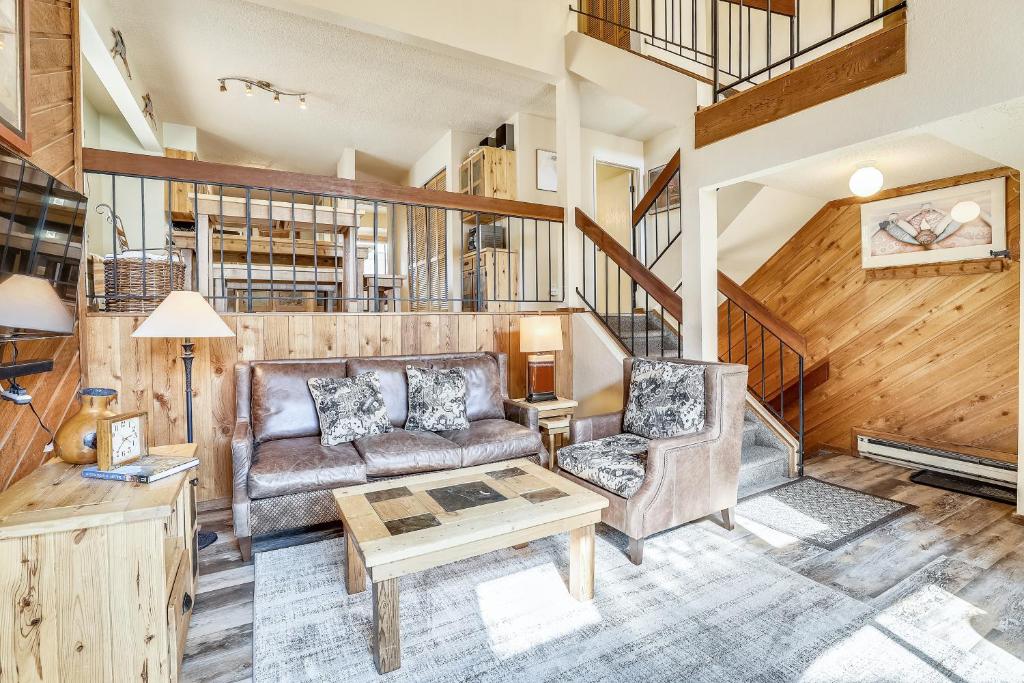 a living room with a couch and a table at Multi-level Cedars 2 Townhome in Breckenridge