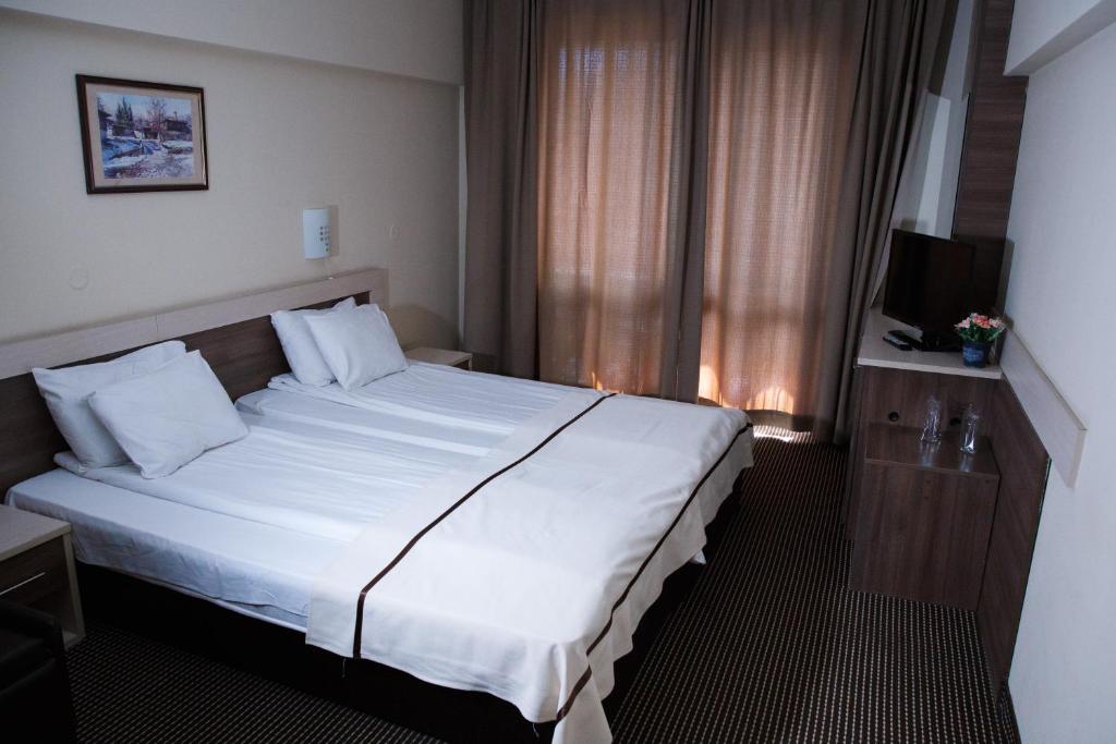 Postel nebo postele na pokoji v ubytování Spa Hotel Kleptuza