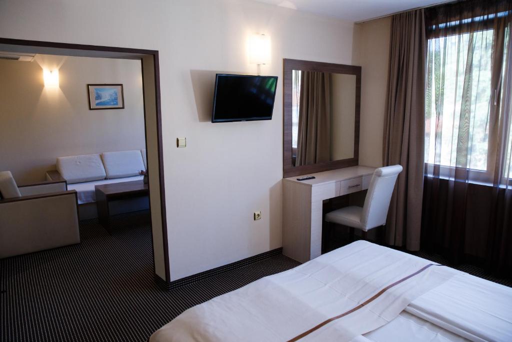 Postel nebo postele na pokoji v ubytování Spa Hotel Kleptuza