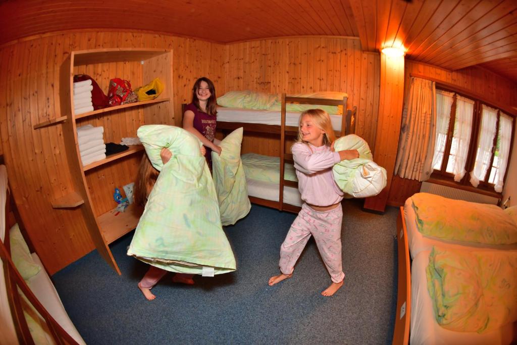 Postel nebo postele na pokoji v ubytování Hotel Wetterhorn