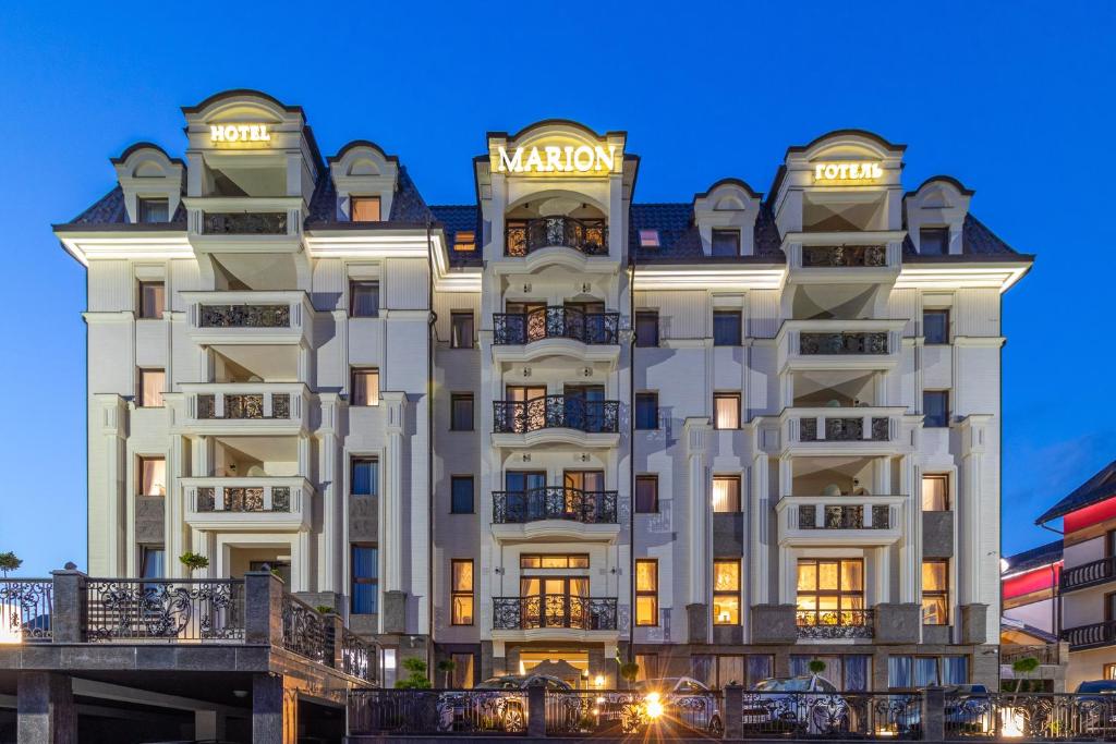 a rendering of the mgm hotel at night at MARION SPA Hotel & Spa - RENOVATION - Rooms, SPA area, Swimming pool, Reception, Restaurant, Lounge Bar, Hookah bar, Children's room, Parking, SPA and Breakfast included in the price in Bukovel