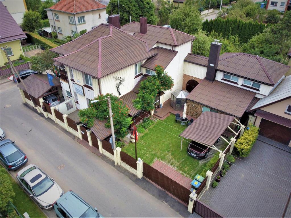 an aerial view of a house with cars parked in front at Cosy House Kaunas & Parking in Kaunas